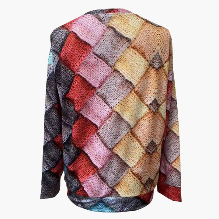 Färgstark mönstrad vintertröja för kvinnor. Långärmad stickad design, bekväm och stilren för kalla dagar.