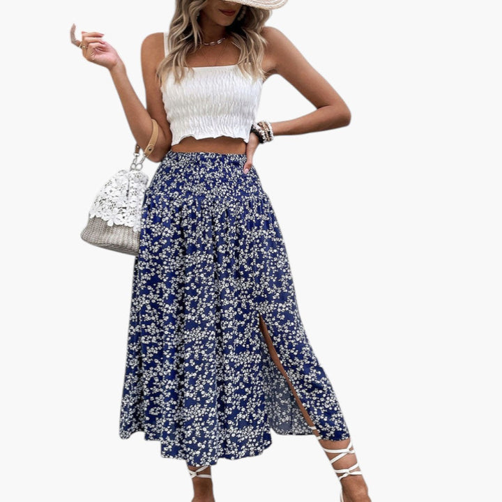 Kvinnors sommar maxikjol, mörkblå med blommor, hög midja och chic sidoflik. Bekväm elegant A-linje kjol.