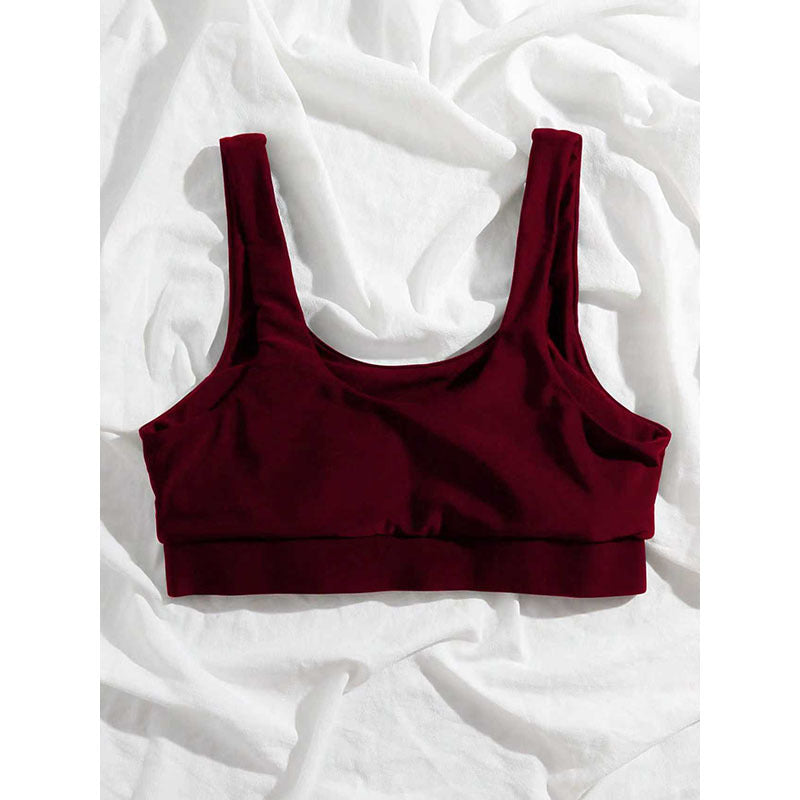 Stilren mörkröd sport-bh crop top, idealisk för damträning, gymmet eller som bekvämt vardagsplagg.