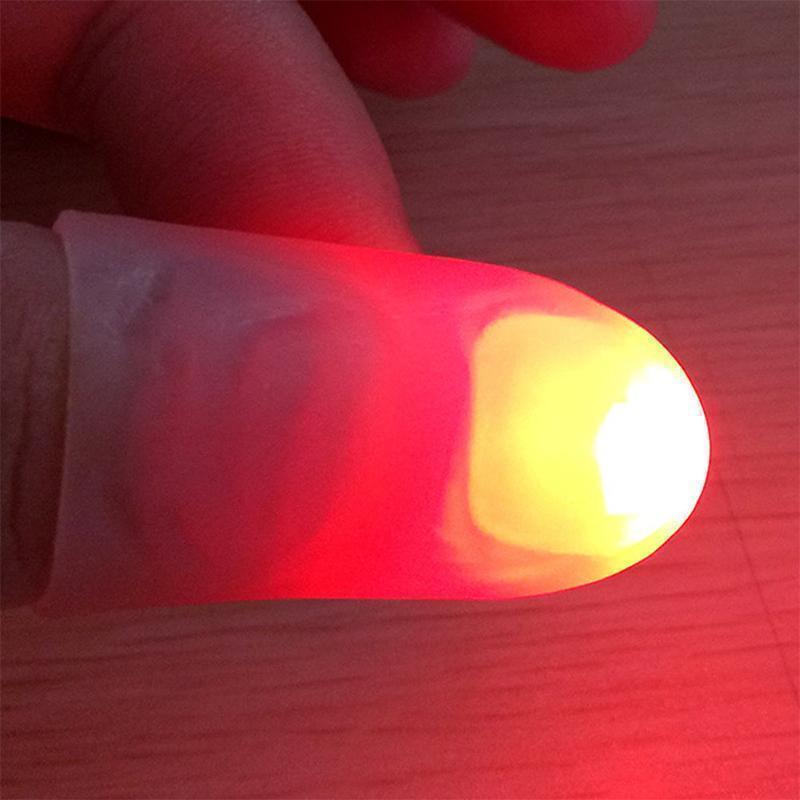 "Magisk tumme LED leksak: Färgglada ljus på fingertopparna, perfekt för magiska tricks och spännande ljusshower."