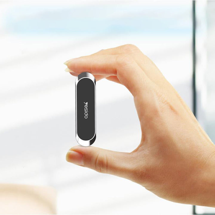 "Magnetisk telefonhållare med 360° rotation, kompakt design i svart, silver och gyllene för bil och hem."