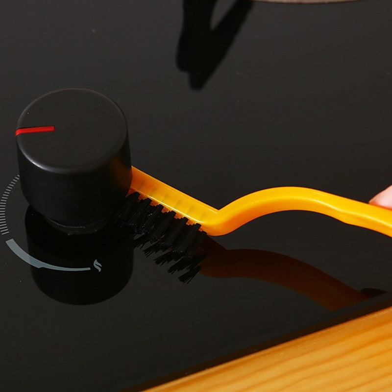 Rengöringsborste för spisfläkt med tre olika borsthuvuden: järn-, koppar- och nylontråd. Ergonomiskt handtag för bekväm användning i köket.
