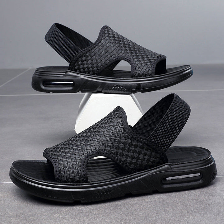 Herr luftiga svarta strandsandaler med elastisk rem, öppen tå och mjuk luftkuddesula för optimal sommarkomfort.