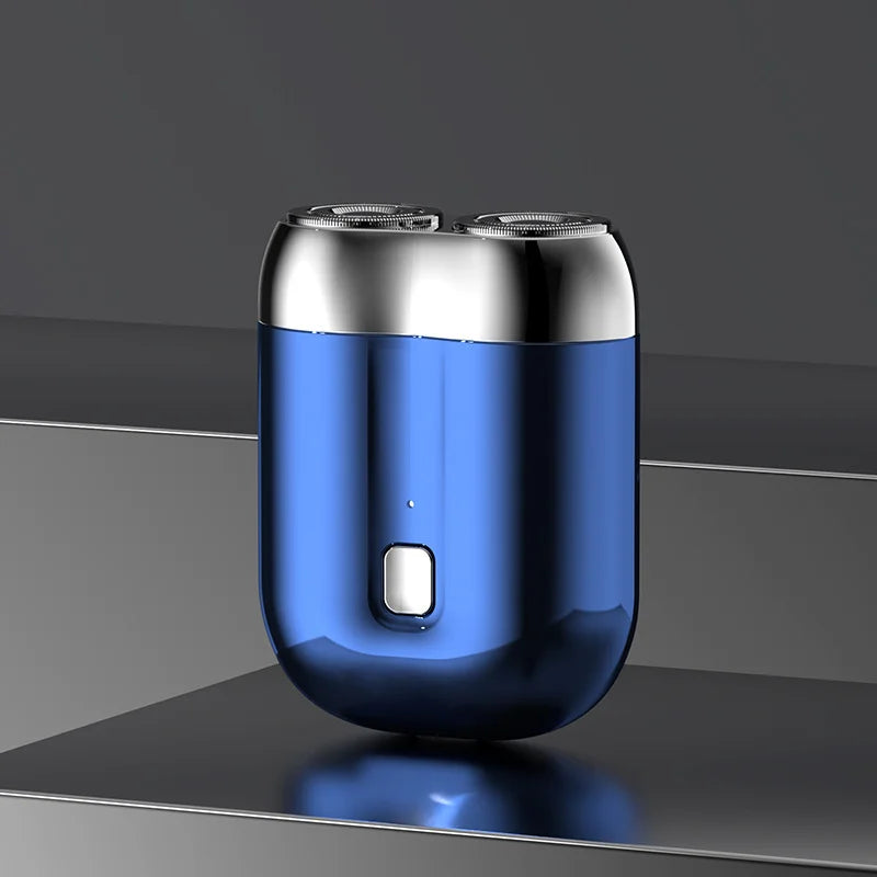 Mini elektrisk rakapparat för män, bärbar, vattentät, kompakt design med rostfria stålblad och elegant finish.