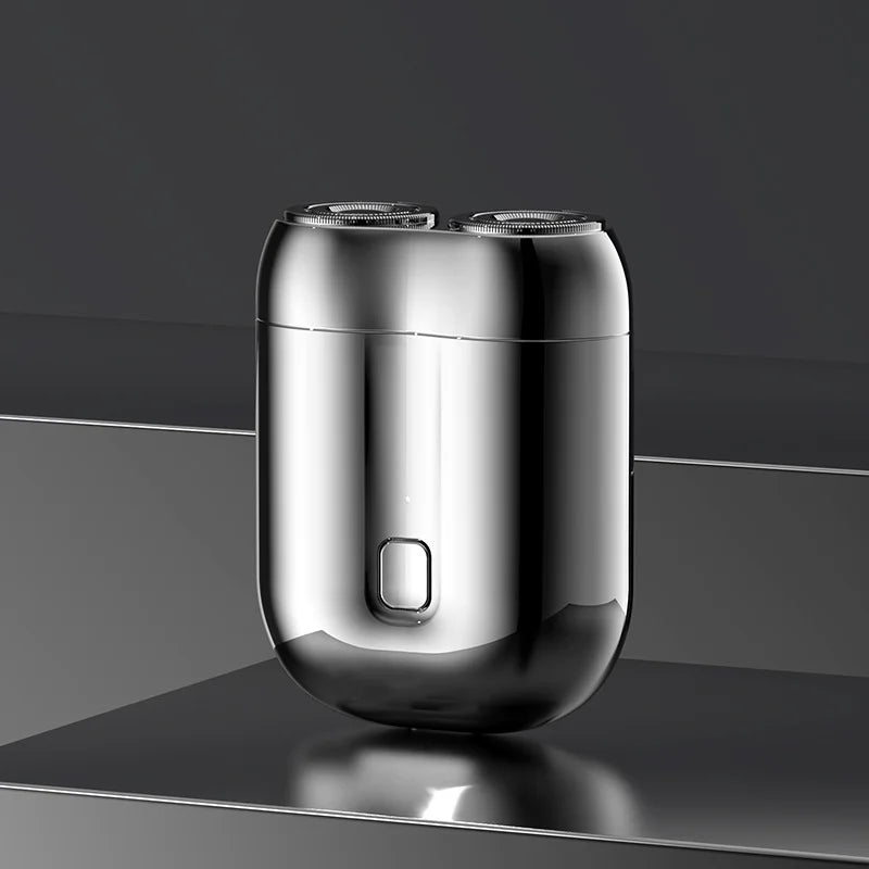 Mini elektrisk rakapparat för män, bärbar, vattentät, kompakt design med rostfria stålblad och elegant finish.