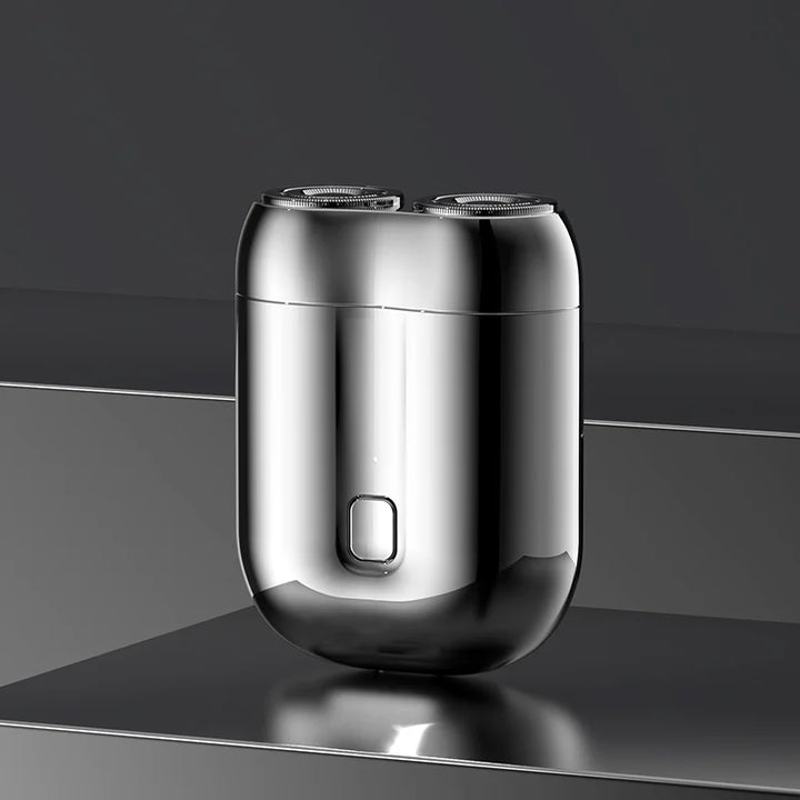 Mini elektrisk rakapparat för män, bärbar, vattentät, kompakt design med rostfria stålblad och elegant finish.