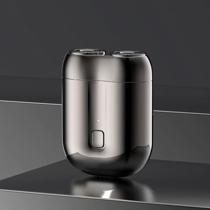 Mini elektrisk rakapparat för män, bärbar, vattentät, kompakt design med rostfria stålblad och elegant finish.