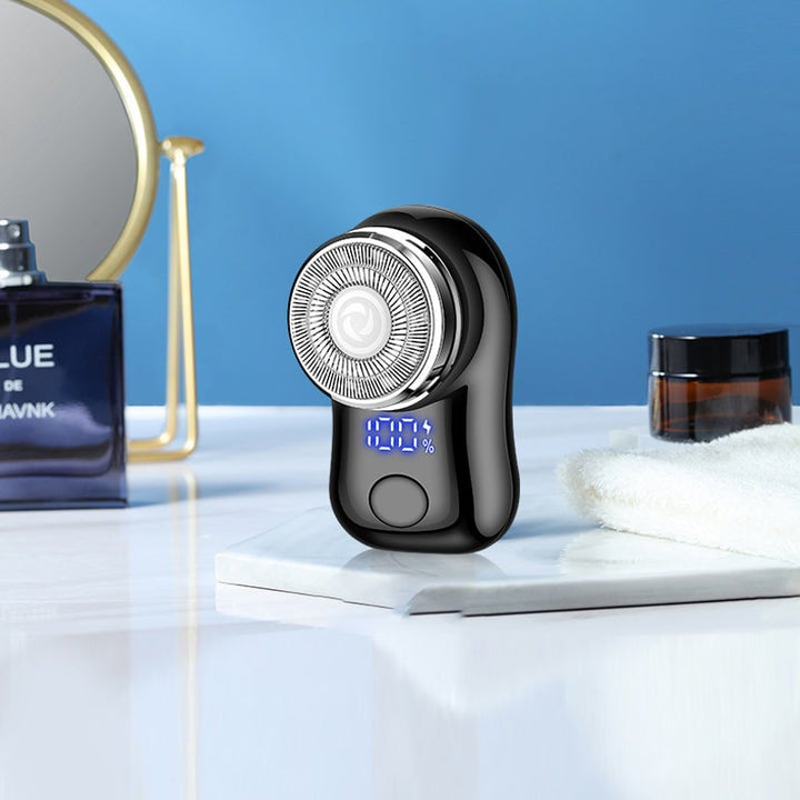 "Mini elektrisk rakapparat med smart digital display och kompakt design för effektiv herrrakning."