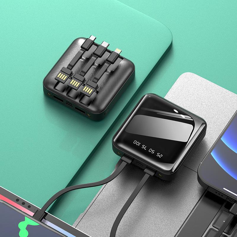 "Mini powerbank med spegelyta, externa kablar; kompakt, elegant design för enkel laddning av enheter på språng."