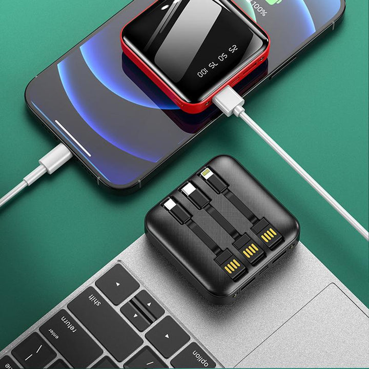 "Mini powerbank med spegelyta, externa kablar; kompakt, elegant design för enkel laddning av enheter på språng."