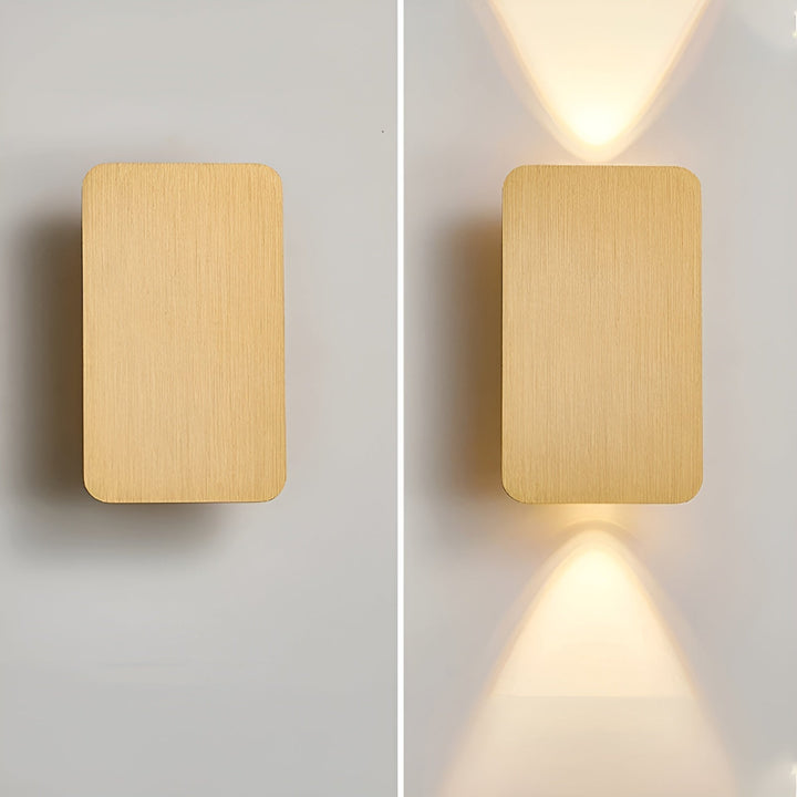 Detaljbild av vägglampa och dess ljussken för harmoniska inredningsdetaljer
