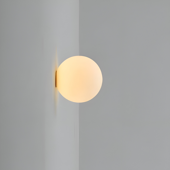 Rund LED-vägglampa för modern heminredning, skapar ett mjukt och inbjudande ljus.