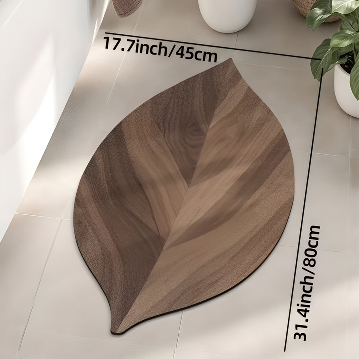 Snygg badrumsmatta med absorberande funktion och dekorativ lövdesign för ditt moderna hem.