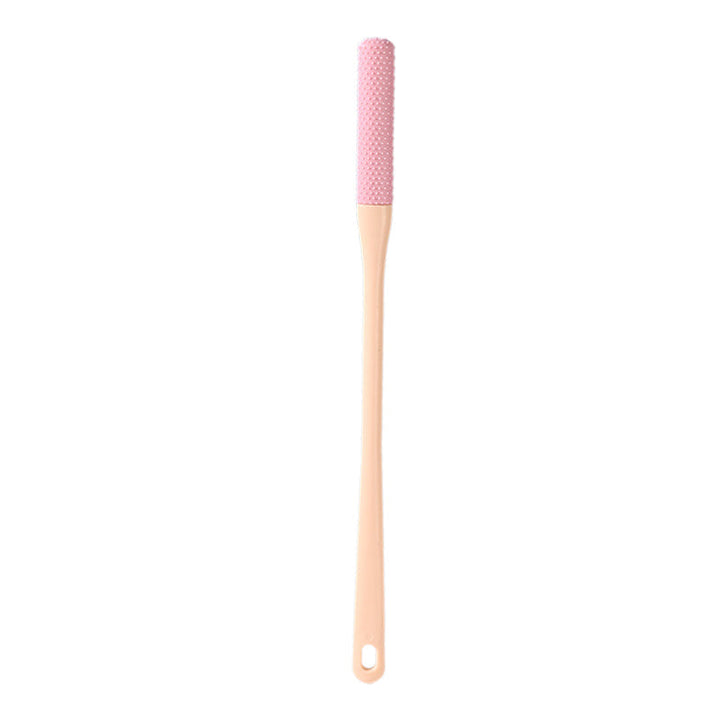 Mjuk grå ergonomisk tåborste med skonsamma borst, perfekt för effektiv fotvård.