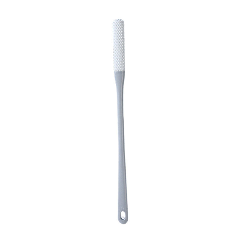Mjuk grå ergonomisk tåborste med skonsamma borst, perfekt för effektiv fotvård.