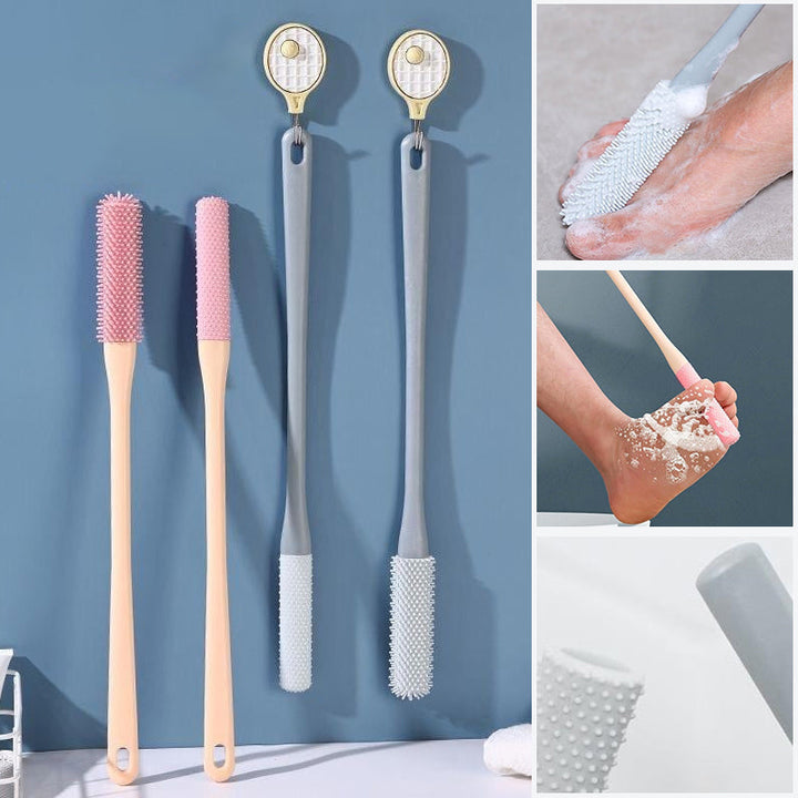 Mjuk grå ergonomisk tåborste med skonsamma borst, perfekt för effektiv fotvård.