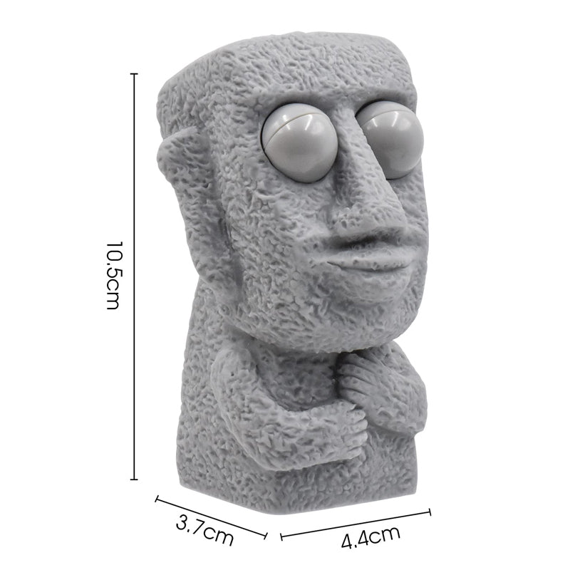 Moai LED stressleksak med utstickande ögon, grå/brun färg, kompakt design, perfekt för stressavlastning och dekoration.