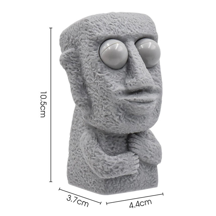 Moai LED stressleksak med utstickande ögon, grå/brun färg, kompakt design, perfekt för stressavlastning och dekoration.