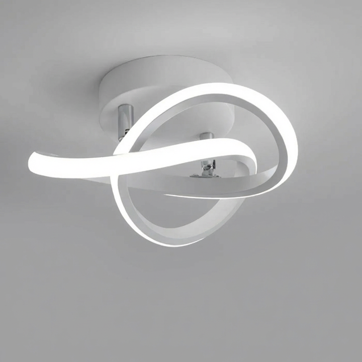 Vågformad vit LED-taklampa som lyser upp rummet