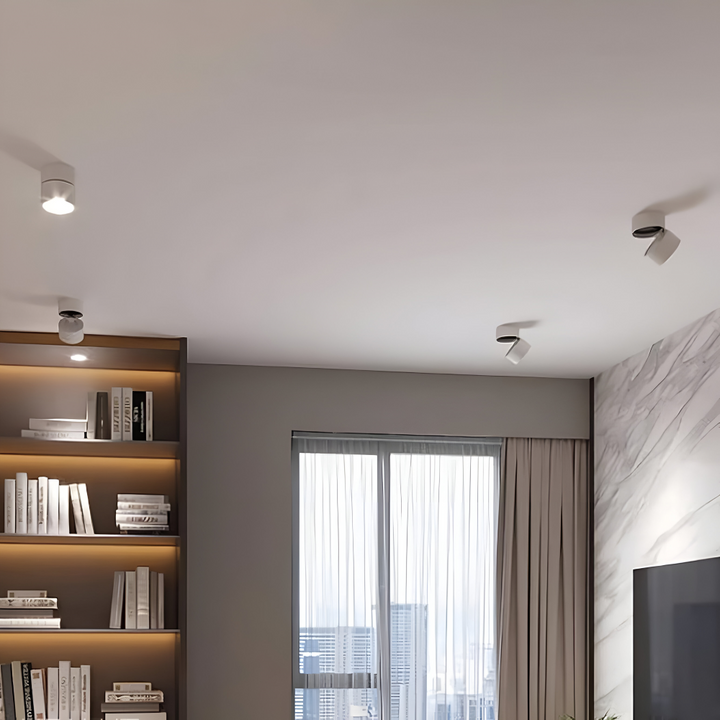 Vit modern LED spotlight taklampa, ger flexibel och riktbar belysning i hemmet.