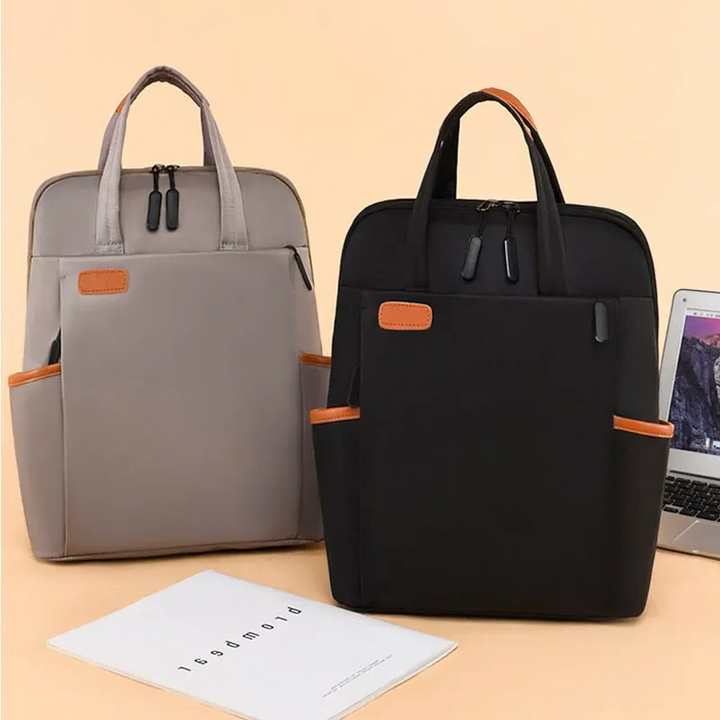 Modern unisex ryggsäck för pendling och resor. Anti-stöld design med dolda blixtlås, vattentålig för alla väder.