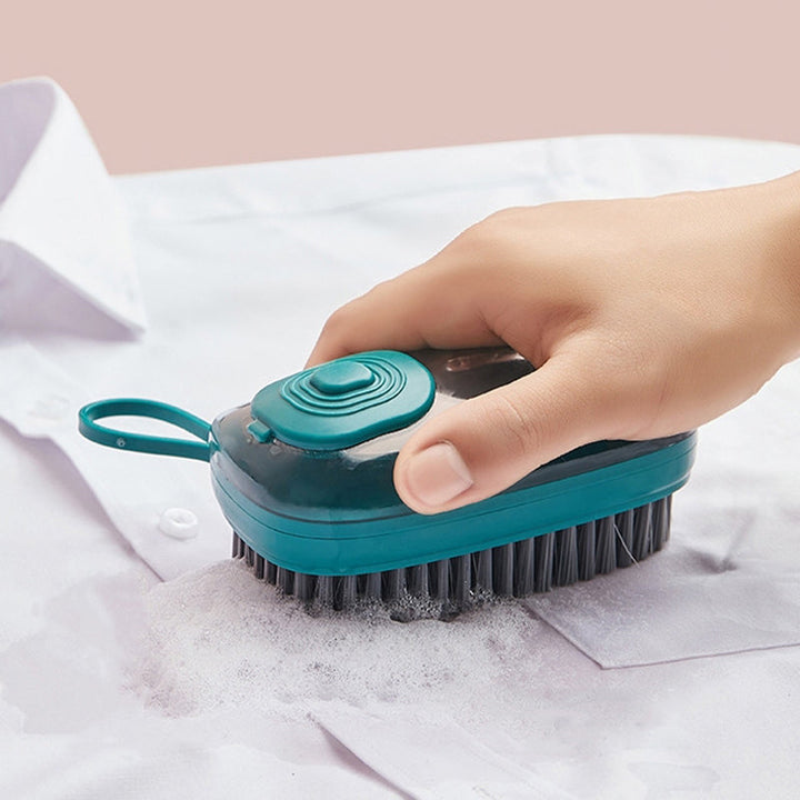 Multifunktionell ergonomisk rengöringsborste i ABS-plast med bekvämt grepp och vätskedispensersystem för köket.