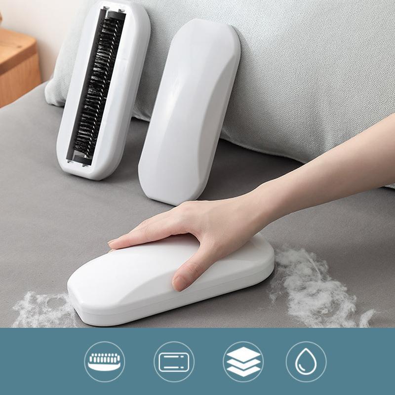 "Multifunktionell ergonomisk rullborste vit/grå, stilren och effektiv för rengöring av olika ytor."