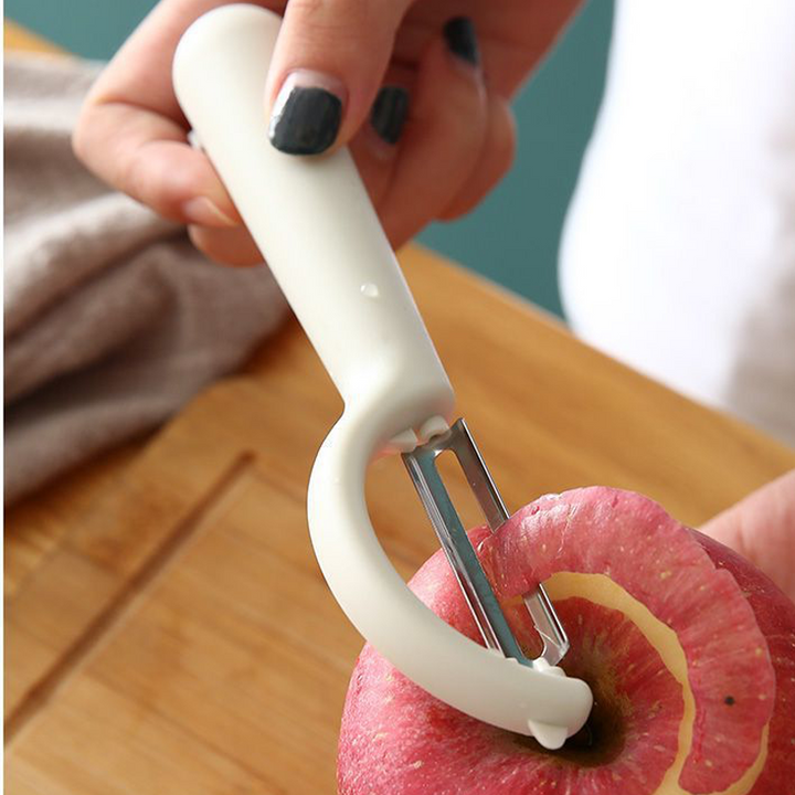 "Multifunktionell ergonomisk skalkniv i hållbart rostfritt stål med skarpt blad och bekvämt handtag för enkel skalning."