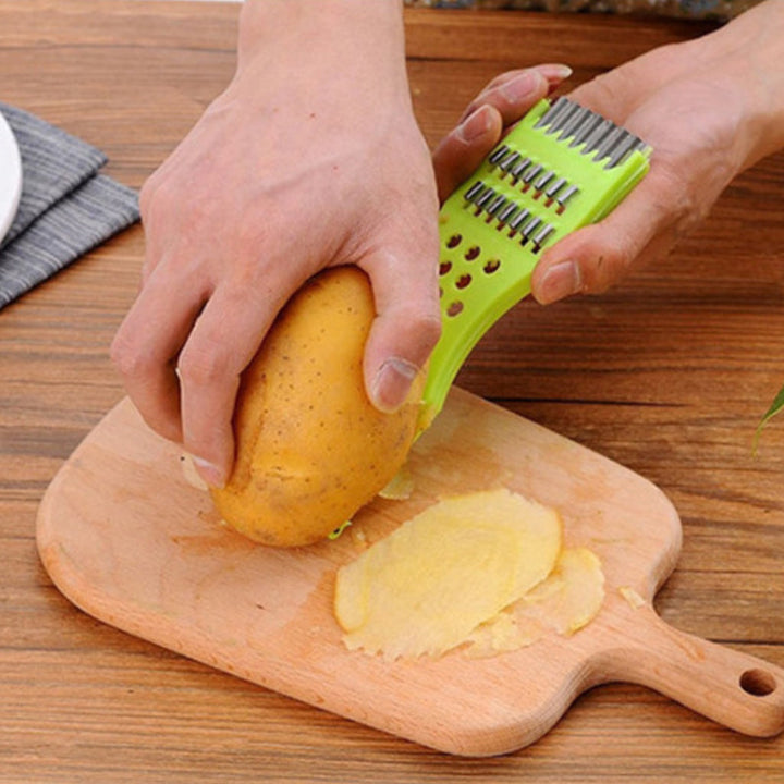 "Multifunktionell köksskalare 5-i-1 med rostfritt stålblad, ergonomisk design, perfekt för skala och skära frukt och grönsake