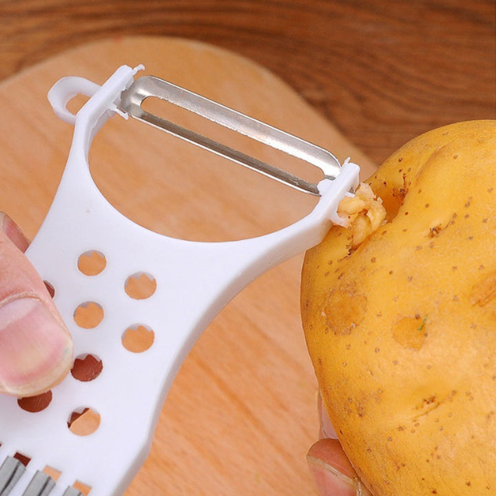 "Multifunktionell köksskalare 5-i-1 med rostfritt stålblad, ergonomisk design, perfekt för skala och skära frukt och grönsake