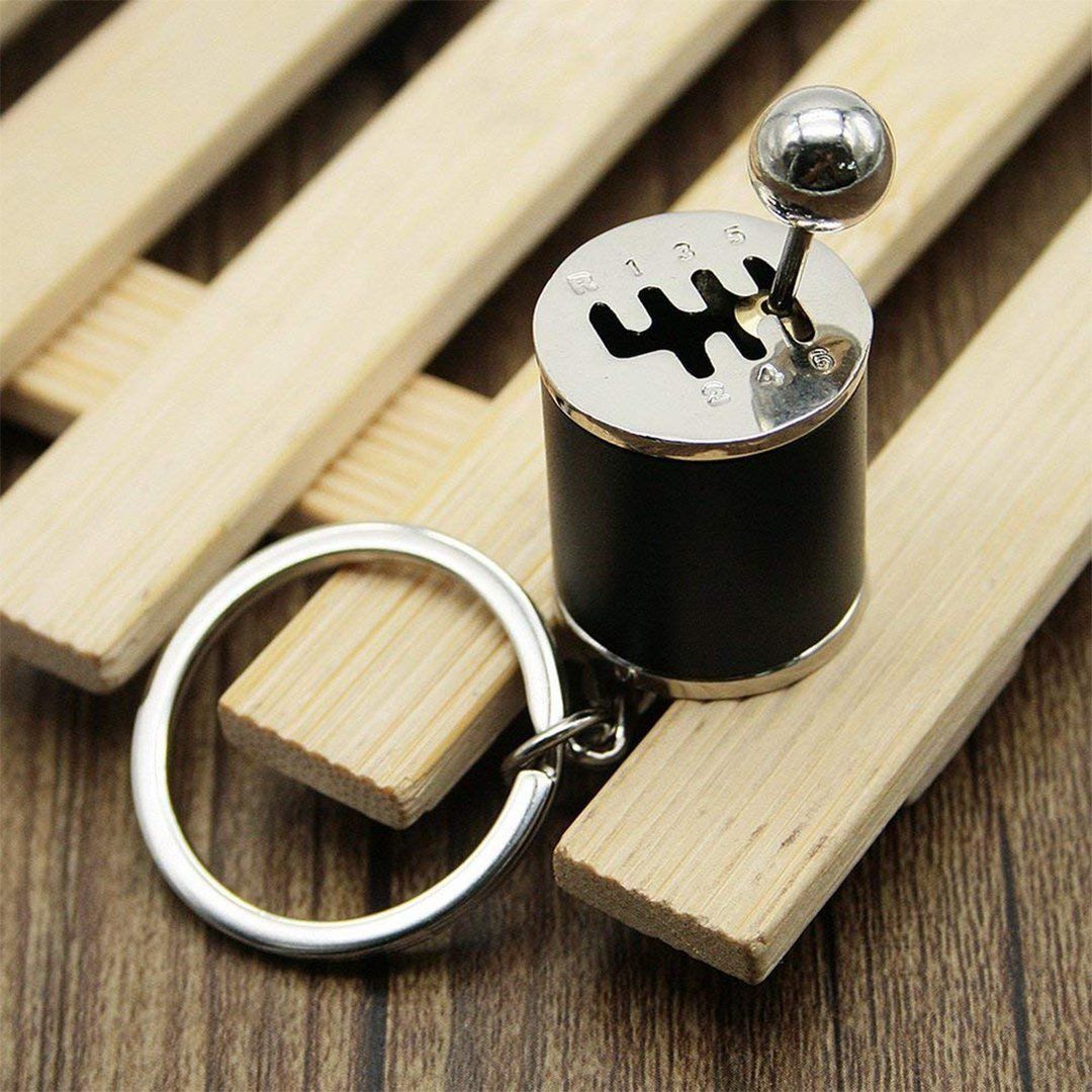 Nyckelring med metallväxelspak, realistisk design med sex växlar, perfekt för bilentusiaster.