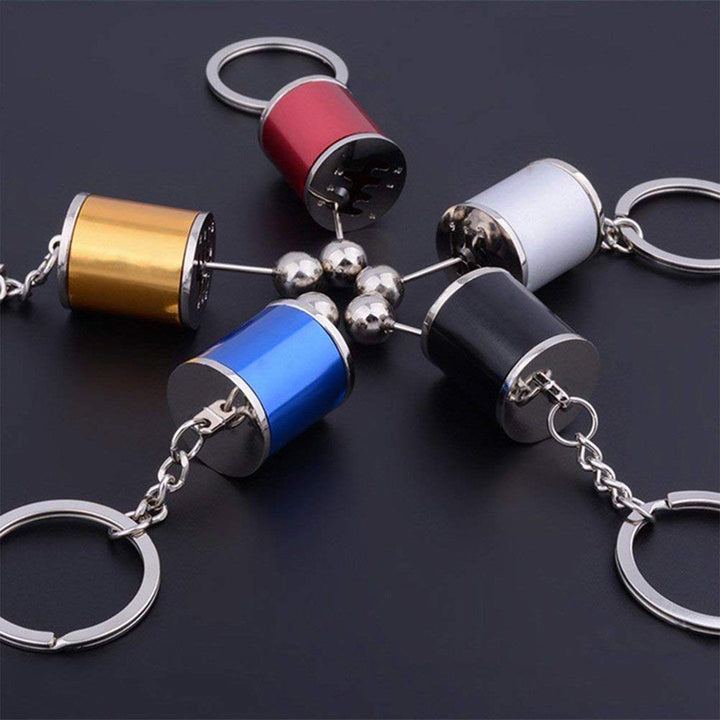 Nyckelring med metallväxelspak, realistisk design med sex växlar, perfekt för bilentusiaster.