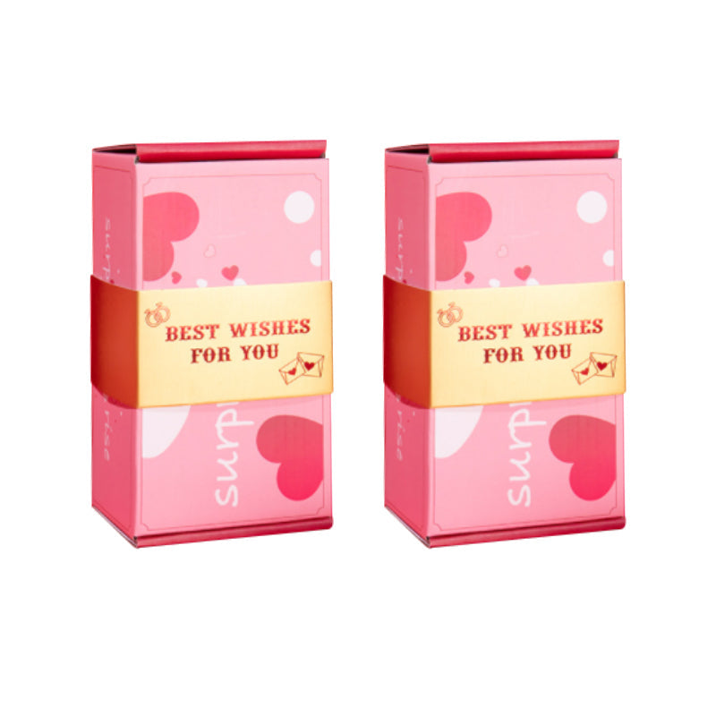 Överraskningspresentask med popup-effekt i glada färger som rosa och gul, perfekt för födelsedagar och fester.
