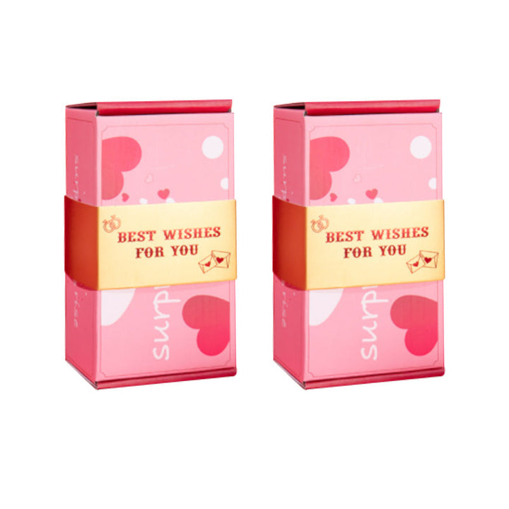 Överraskningspresentask med popup-effekt i glada färger som rosa och gul, perfekt för födelsedagar och fester.