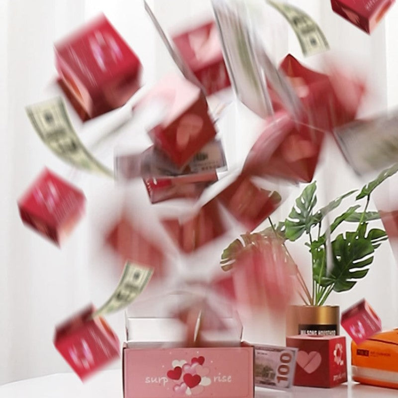 Överraskningspresentask med popup-effekt i glada färger som rosa och gul, perfekt för födelsedagar och fester.