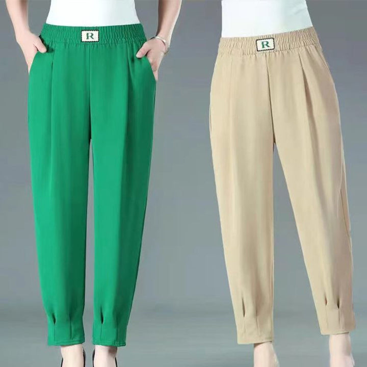 Plus size harembyxor för damer i grön, med hög midja och lös passform, perfekt för vardagsbruk och avslappnade tillfällen.