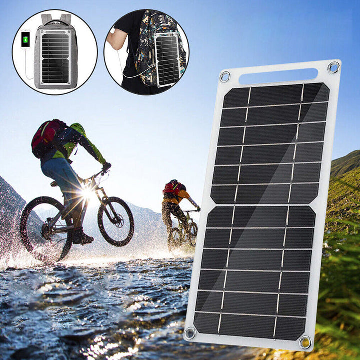 "Portabel 30W solpanel med USB, tunn design, svart yta, sugkoppar för montering, perfekt för utomhusäventyr."
