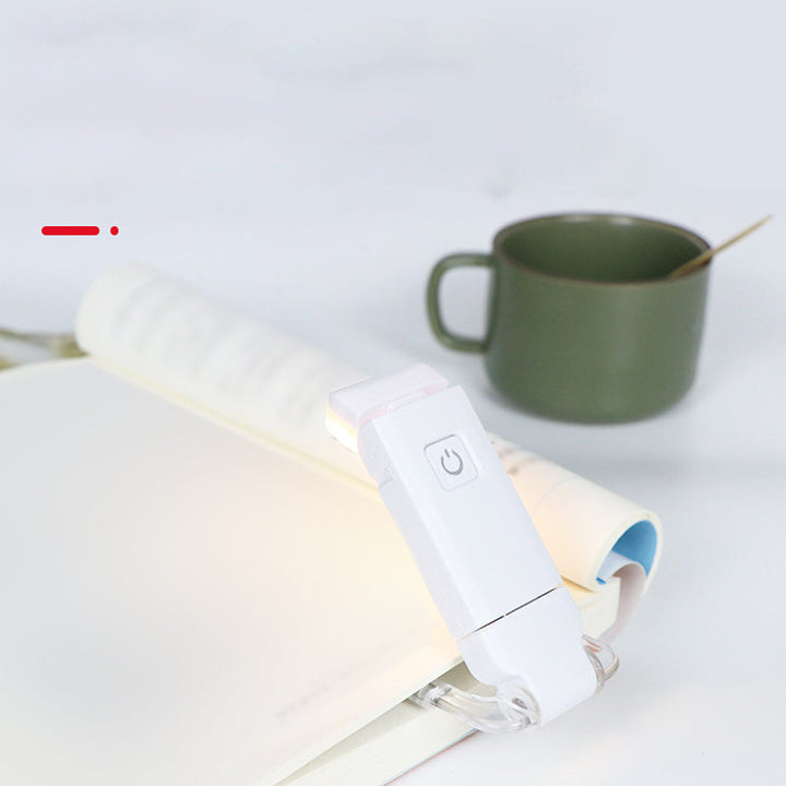 "Portabel justerbar uppladdningsbar LED-boklampa i rosa, svart, grön, blå eller vit med flexibel hållare och USB-laddning."