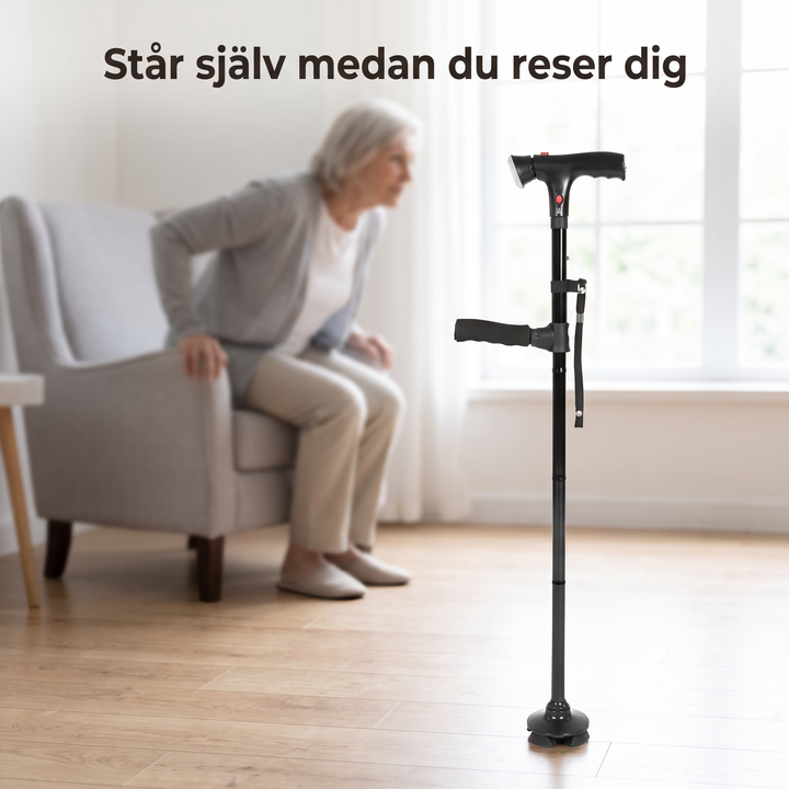 Självstående käpp placerad bredvid en fåtölj i ett vardagsrum