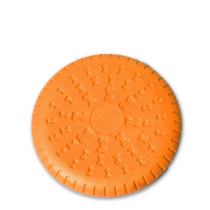 Flexibel grön hundleksak frisbee i slitstarkt gummi, perfekt för långvarig lek och aktiv hundträning utomhus.