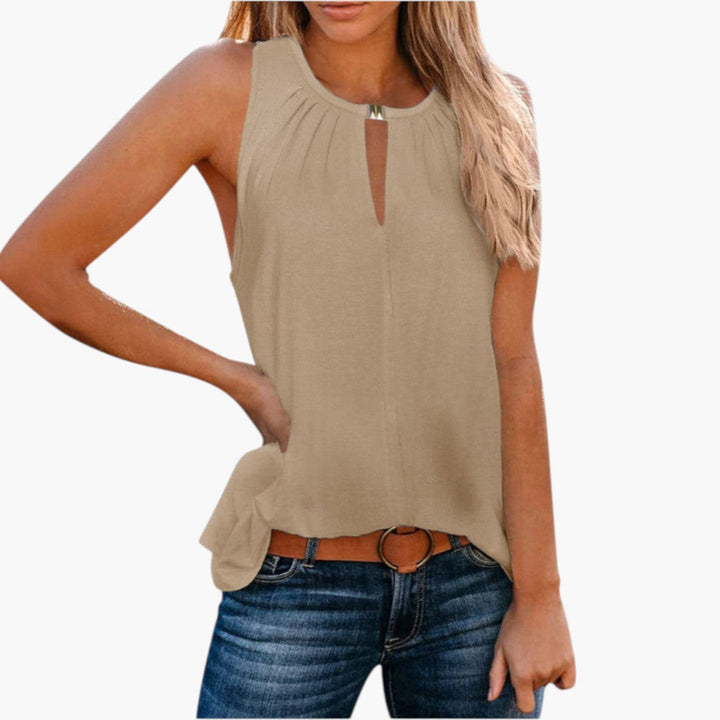 Elegant ärmlös damtopp med snygg veckad front & diskret droppöppning, idealisk för casual sommarstil.