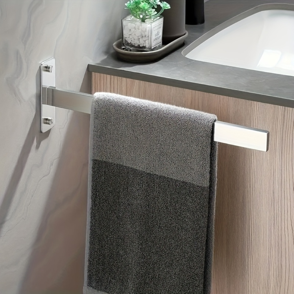 Kompakt handdukshållare i modern rostfri design. Optimal för små badrum, väggmonterad.