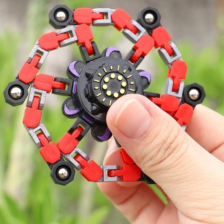 "Röd plast fidget spinner med sugkopp, färgglad och ergonomisk design för barn och vuxna, perfekt för stresslindring."
