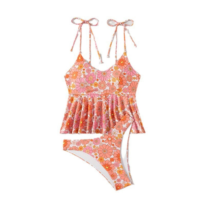 Baksida av rosa volangtankini med blommigt mönster. Snygg och bekväm badmode för dam, storlek S-XL.
