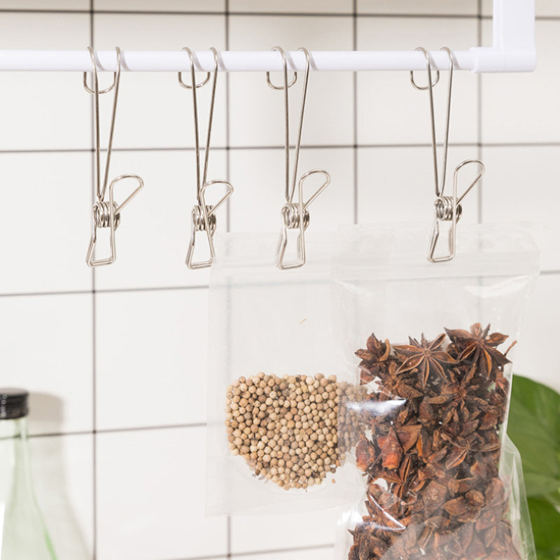 Rostfri metalklämma med lång svans, silverfärgad, perfekt för kök och badrum, hållbar design för smart förvaring.