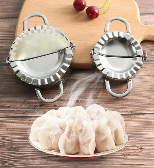 Dumplingmaskin och skalare i rostfritt stål med spegelpolerad yta för enkel och hygienisk användning i hemmakök.