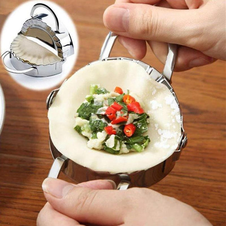Dumplingmaskin och skalare i rostfritt stål med spegelpolerad yta för enkel och hygienisk användning i hemmakök.