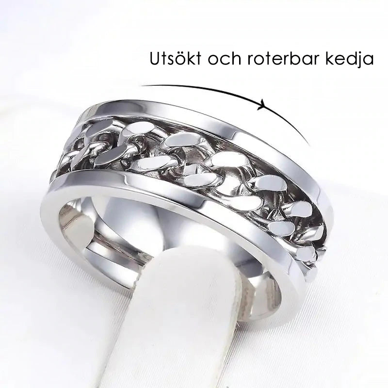 Roterbar unisex ring i titanstål, svart och stilren; elegant accessoar för modern och mångsidig stil.