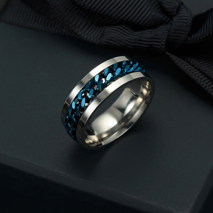 Roterbar unisex ring i titanstål, svart och stilren; elegant accessoar för modern och mångsidig stil.