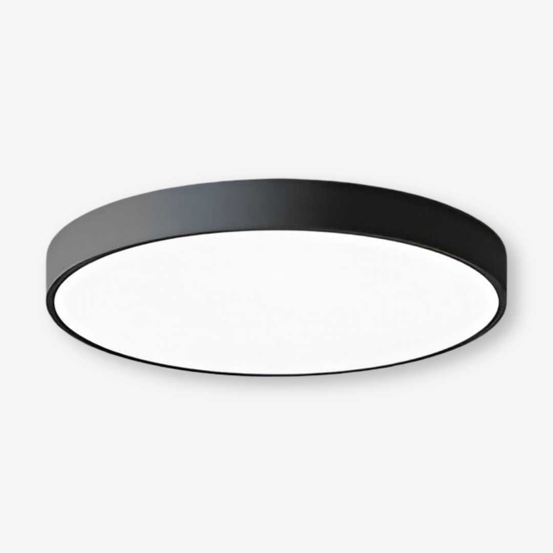 Rund LED taklampa som skapar modern atmosfär. Elegant och platt design för takmontering.